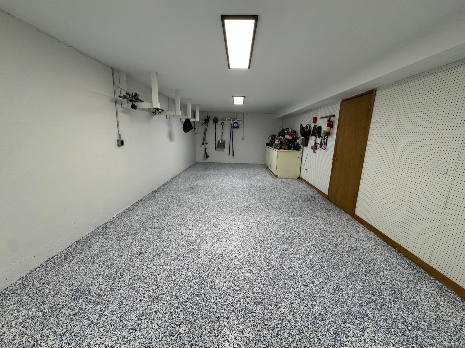 Cleared garage floor after a foreclosure property cleanout in Greensboro NC