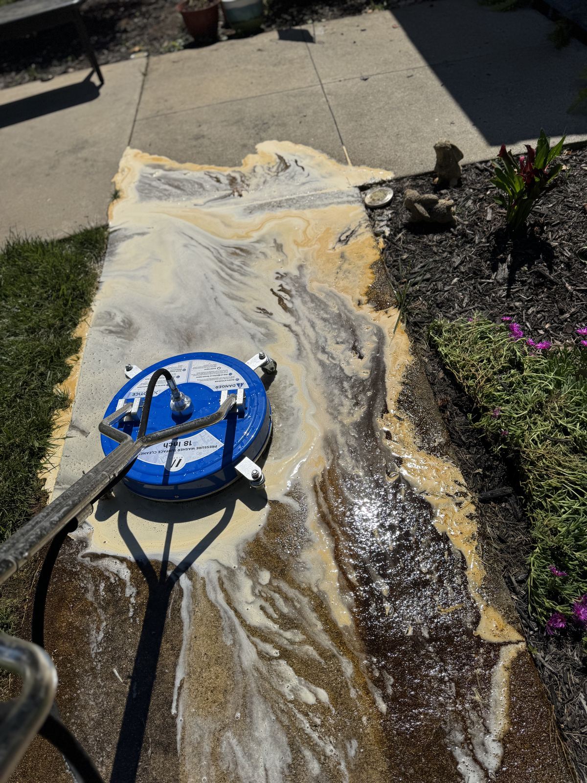 Concrete cleaning foam and pressure washing process