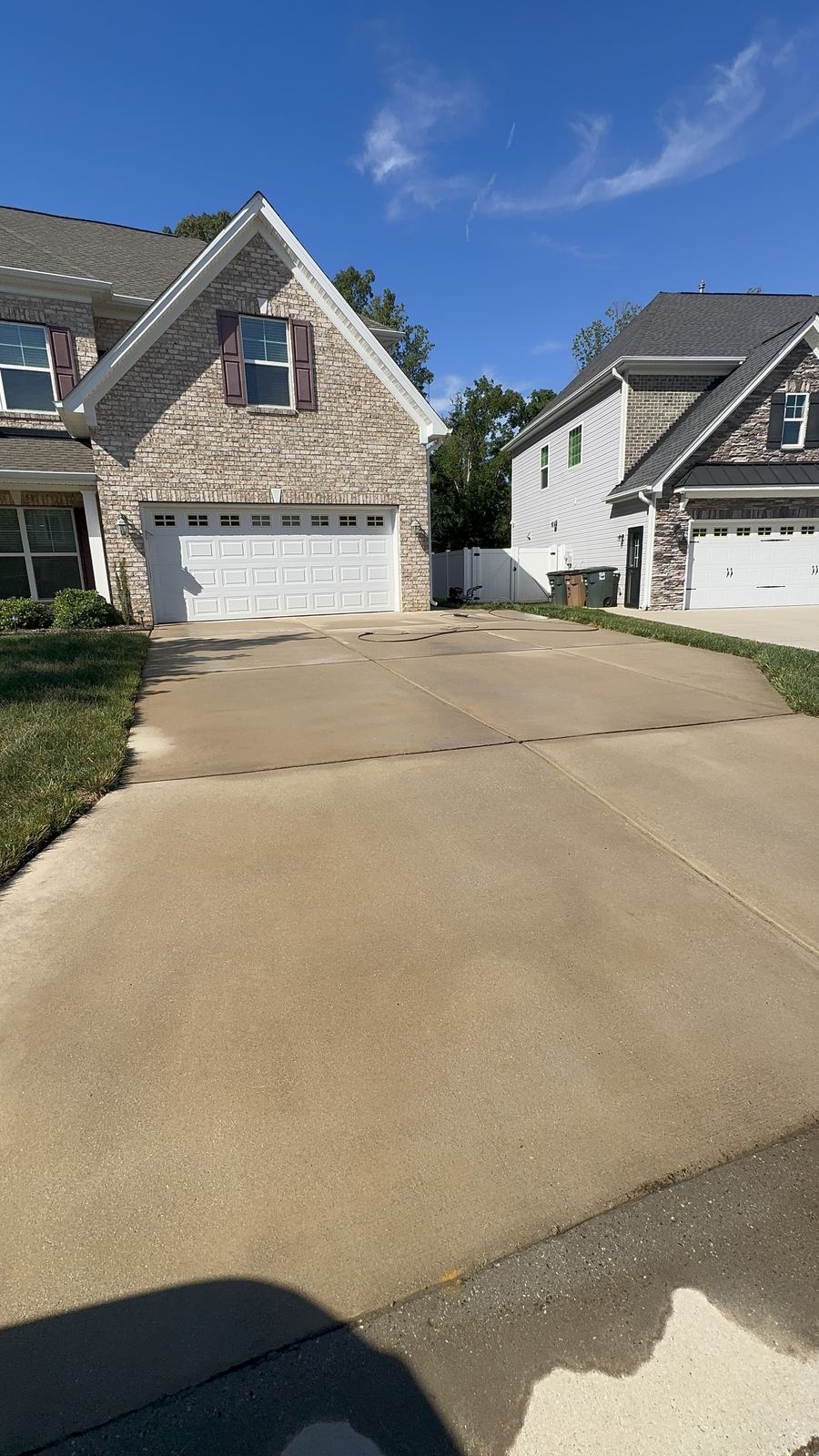 Clean concrete driveway after pressure washing in Greensboro NC