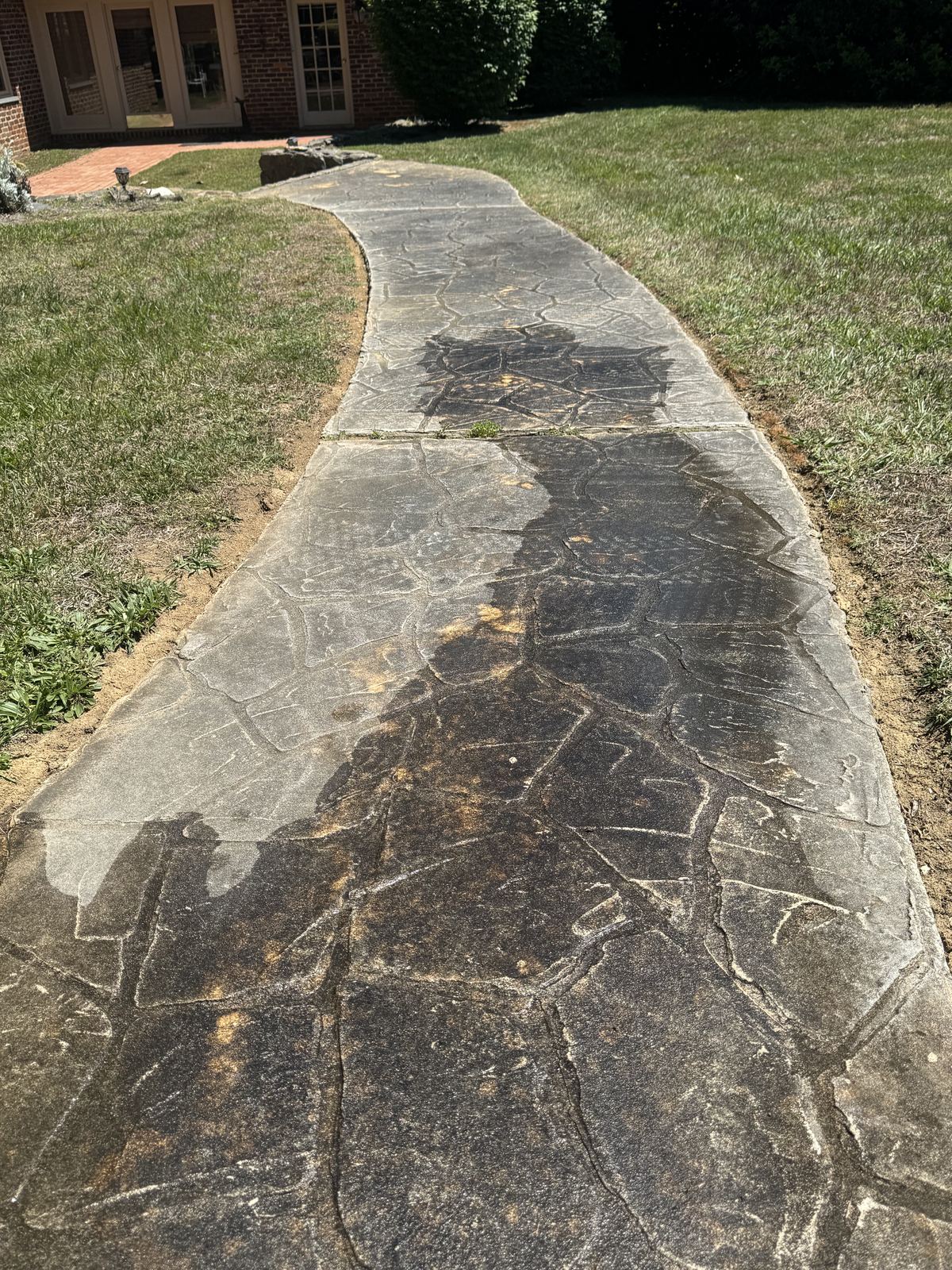 Dirty stone walkway before pressure washing in Greensboro NC